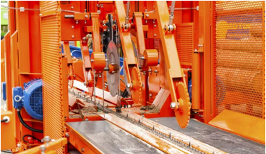 Tolomatic electric rod actuator with ball-screw drive replaces a hydraulic cylinder in a log-cutting operation. Tolomatic electric rod actuator with ball-screw drive replaces a hydraulic cylinder in a log-cutting operation.